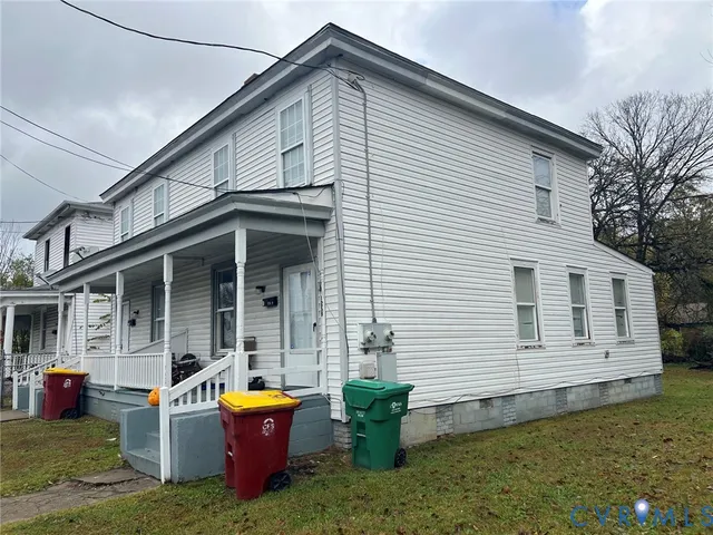 a kitchen with a stove a sink and a refrigerator