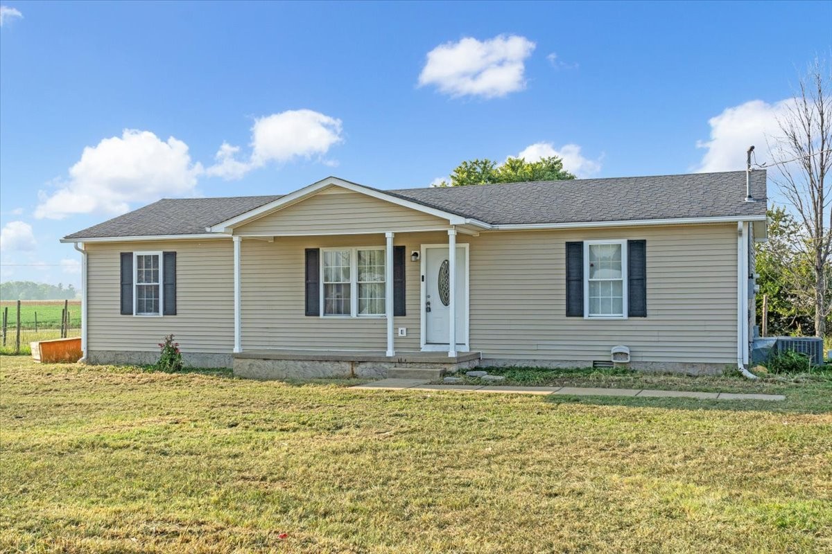 1505 Longview Road Unionville, TN 37180 - Photo 2 of 24 a house with swimming pool in front of it