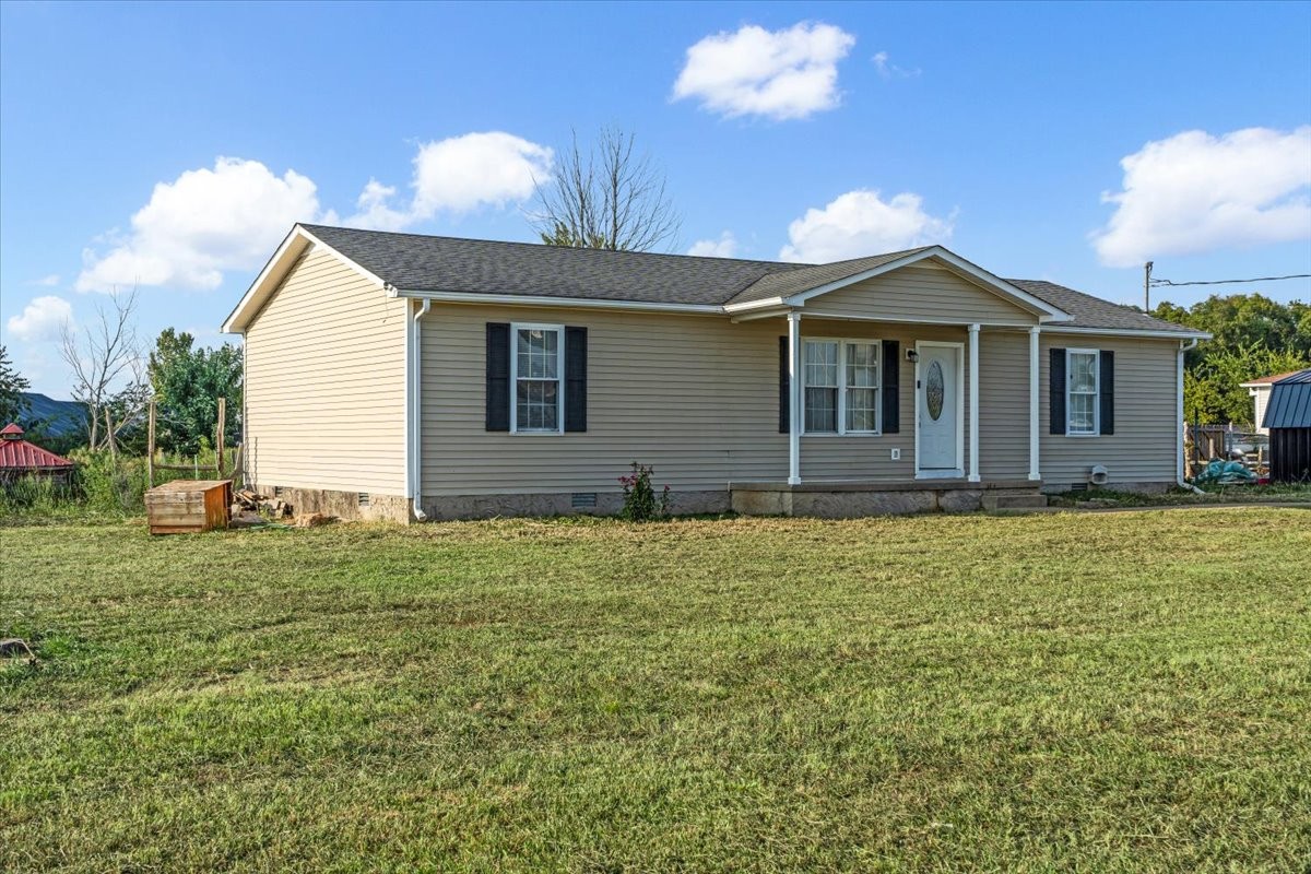 1505 Longview Road Unionville, TN 37180 - Photo 23 of 24 a front view of a house with a garden