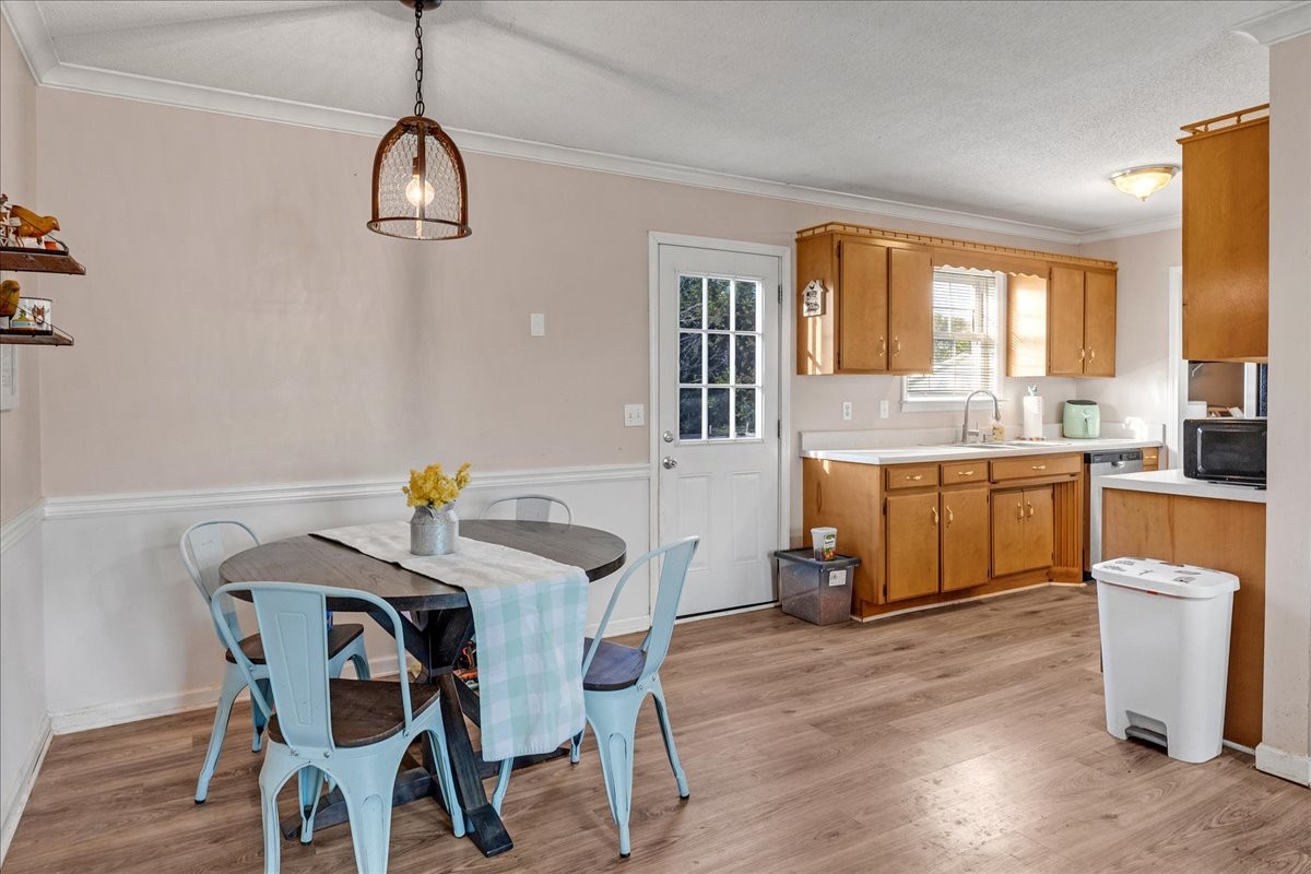 1505 Longview Road Unionville, TN 37180 - Photo 7 of 24 a view of a dining room and livingroom with furniture wooden floor a chandelier