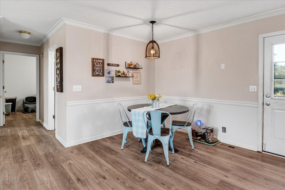 1505 Longview Road Unionville, TN 37180 - Photo 8 of 24 a view of a dining room with furniture and wooden floor