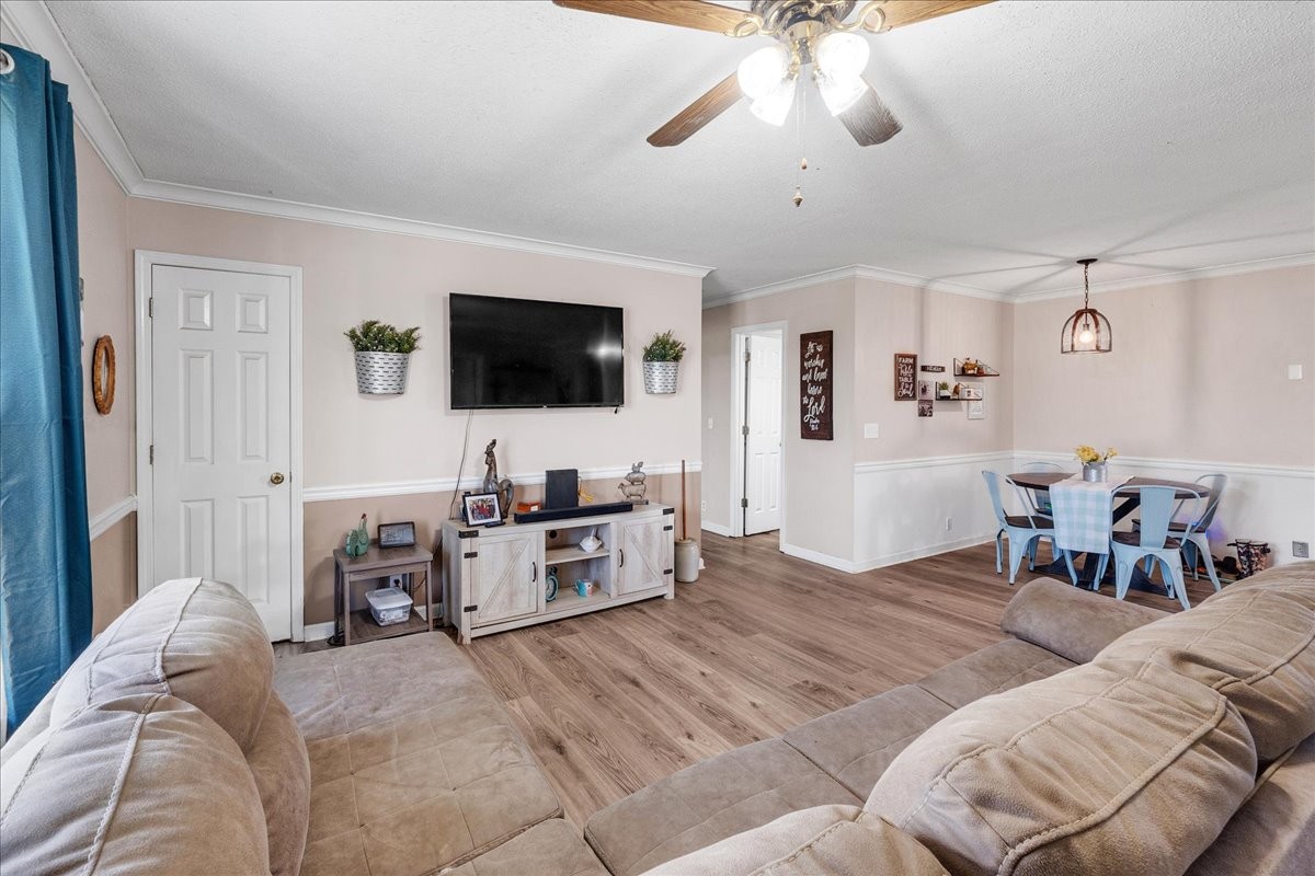 1505 Longview Road Unionville, TN 37180 - Photo 9 of 24 a view of a livingroom with furniture and a flat screen tv