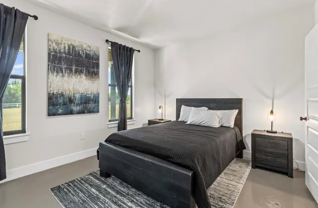 a bathroom with a granite countertop sink a toilet and shower