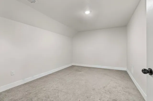 a living room with furniture potted plant and a table