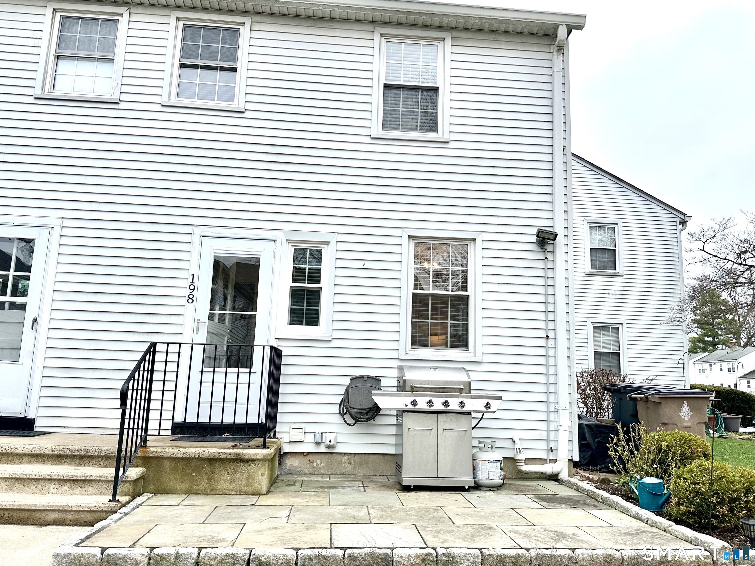198 Sylvan Knoll Road Stamford, CT 06902 - Photo 11 of 17 a view of a house with a patio