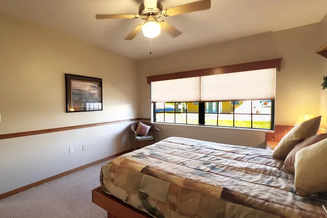 a bedroom with furniture and a wooden floor