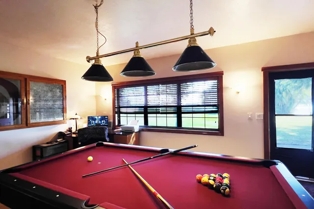 a room with a bed and window