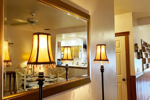 a room with a large window and furniture