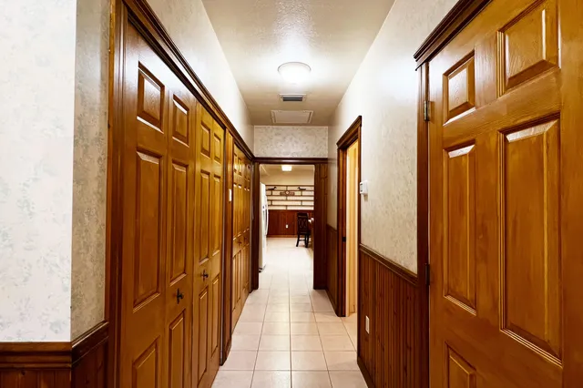 a bathroom with a sink a mirror and a shower