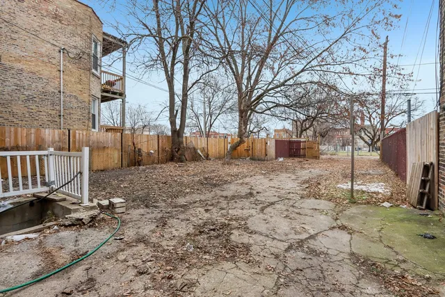 a view of a yard covered with snow in the yard