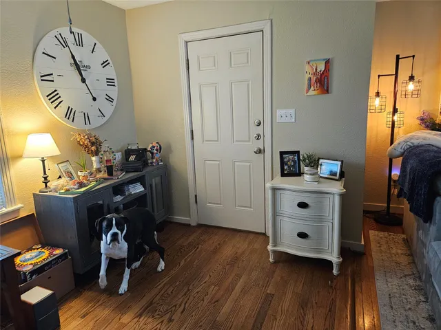 a room with furniture and wooden floor