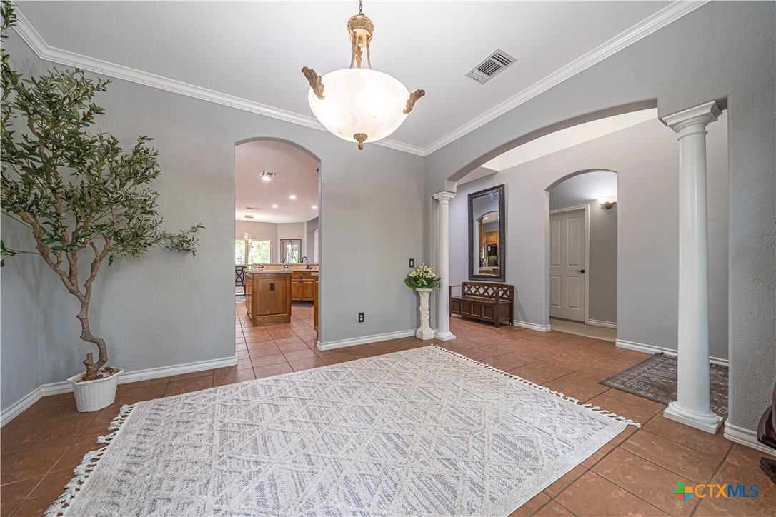 519 Long Meadow Spring Branch, TX 78070 - Photo 7 of 33 a view of a livingroom with wooden floor and a chandelier