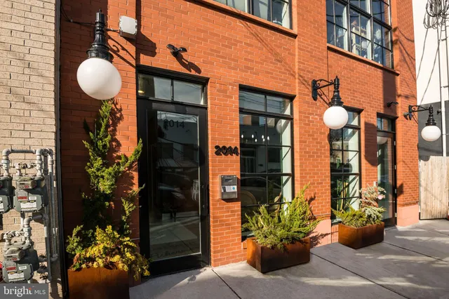 a vase of flowers sitting on a floor