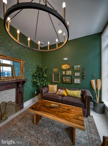a living room with furniture a rug and a window