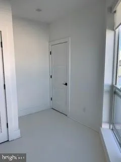 a view of a kitchen with a sink oven cabinets and a large window