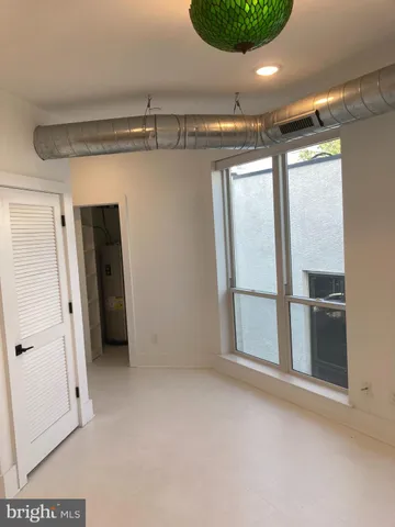 a utility room with sink dryer and washer