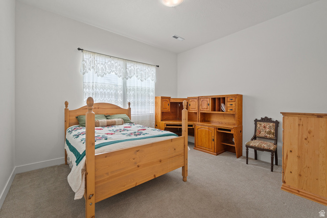 531 North Legend Way West, Unit D Mapleton, UT 84664 - Photo 21 of 42 Bedroom featuring light carpet