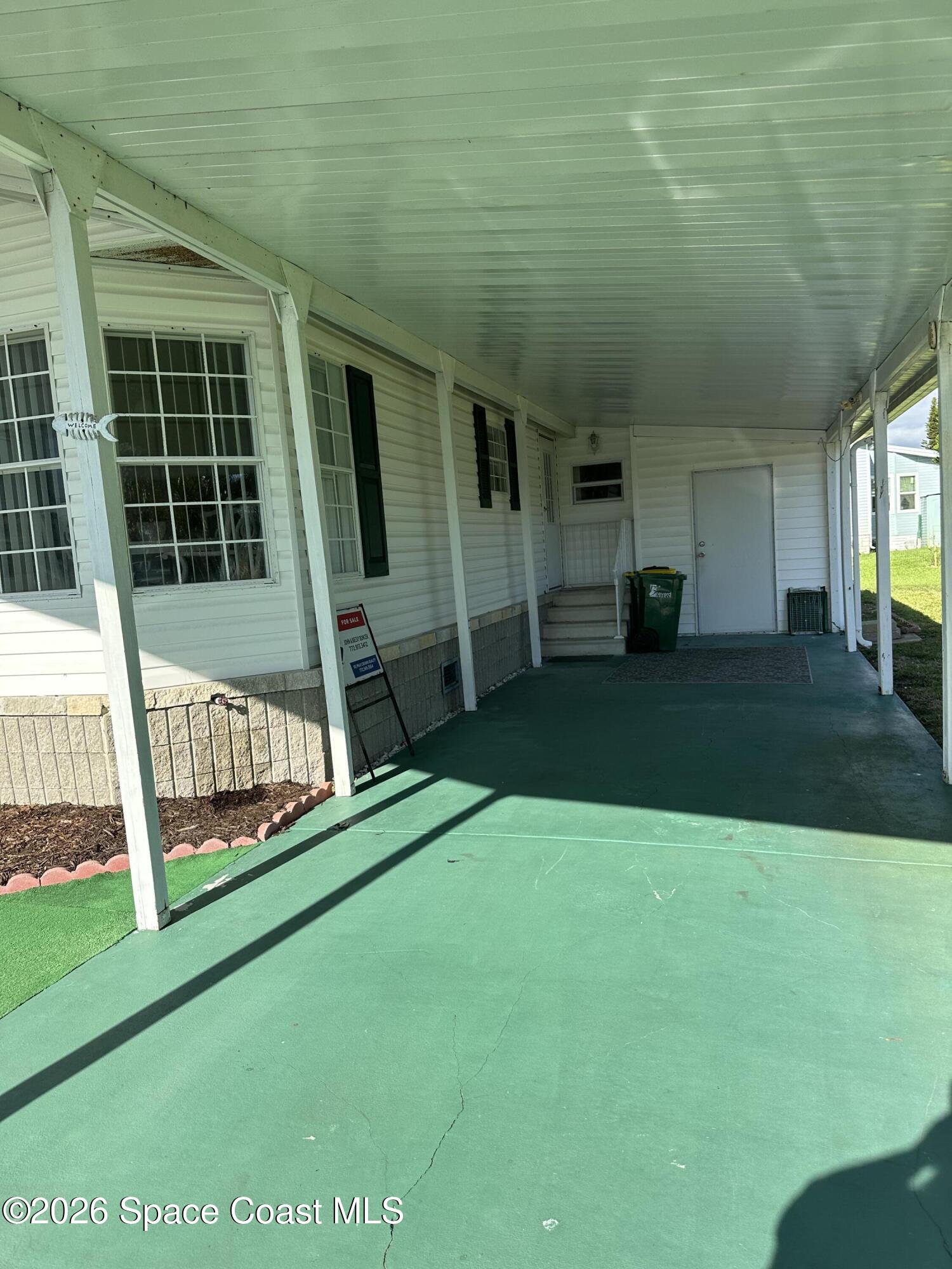 7530 Agawam Road Micco, FL 32976 - Photo 2 of 16 Carport