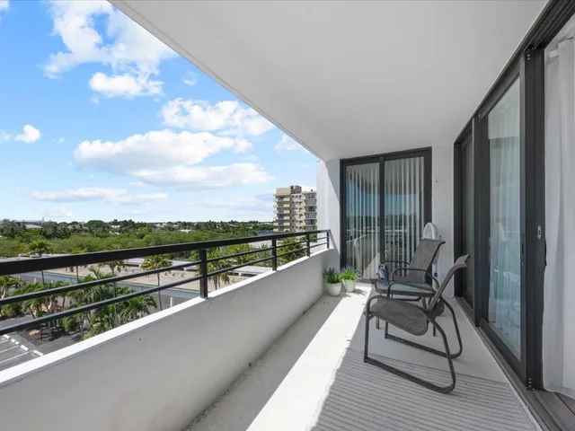 a view of balcony with furniture
