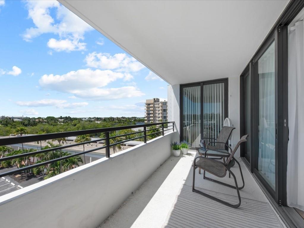 a view of balcony with furniture