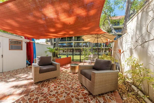 a outdoor living space with patio furniture and garden