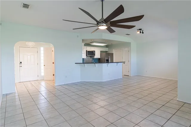 a view of a kitchen with a dishwasher and a microwave