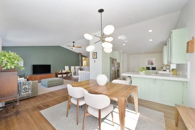 a view of a dining room with furniture window and wooden floor