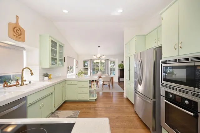 a kitchen with a sink and cabinets
