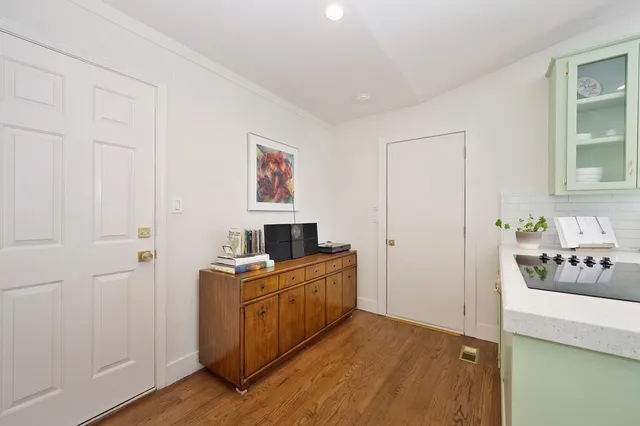 a bathroom with a sink vanity granite and toilet