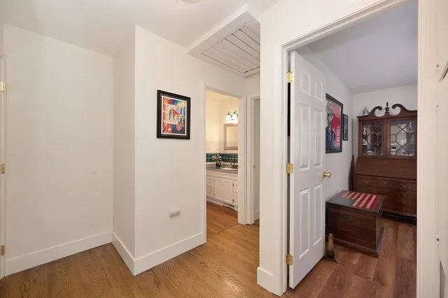 a bathroom with a sink vanity and a mirror
