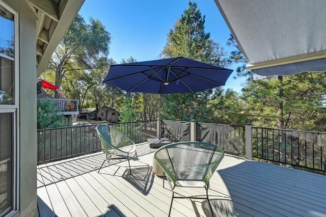 a view of balcony with outdoor seating and wooden floor