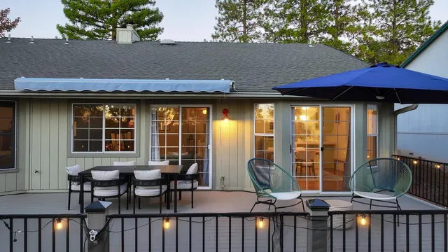 an aerial view of a houses with a lake view