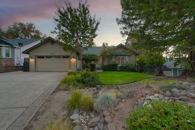 an aerial view of residential houses with outdoor space and river