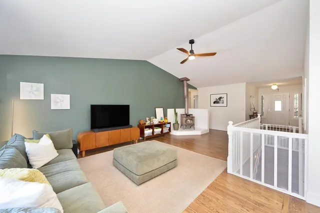 a view of a room with wooden floor and bathroom