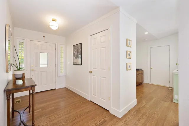 a view of a dining room with furniture wooden floor and chandelier