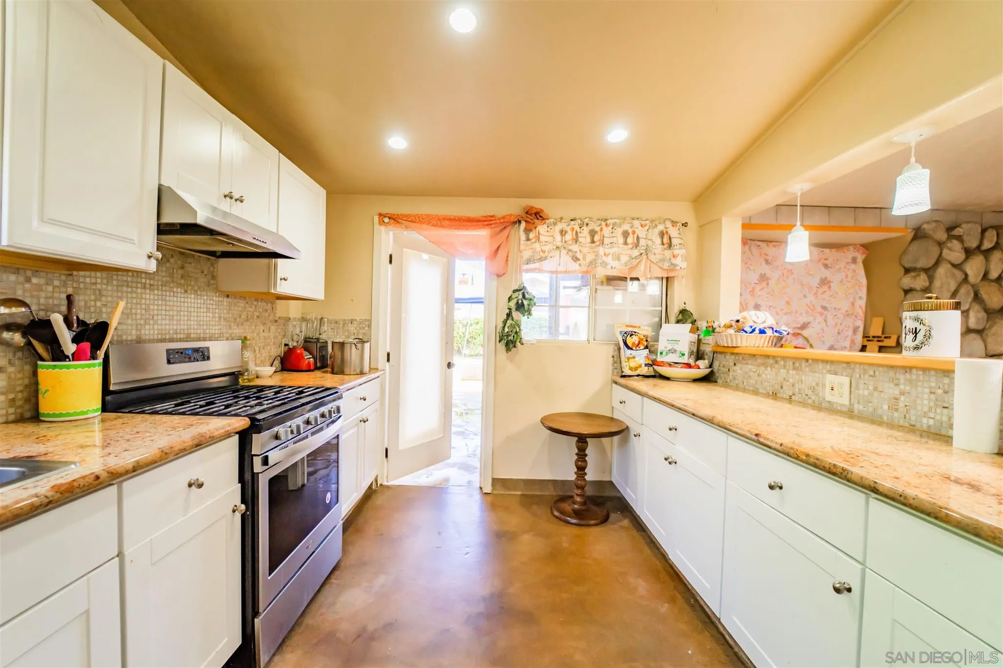 14149 Frame Road Poway, CA 92064 - Photo 11 of 28 a large kitchen with stainless steel appliances granite countertop a lot of counter space and wooden floors
