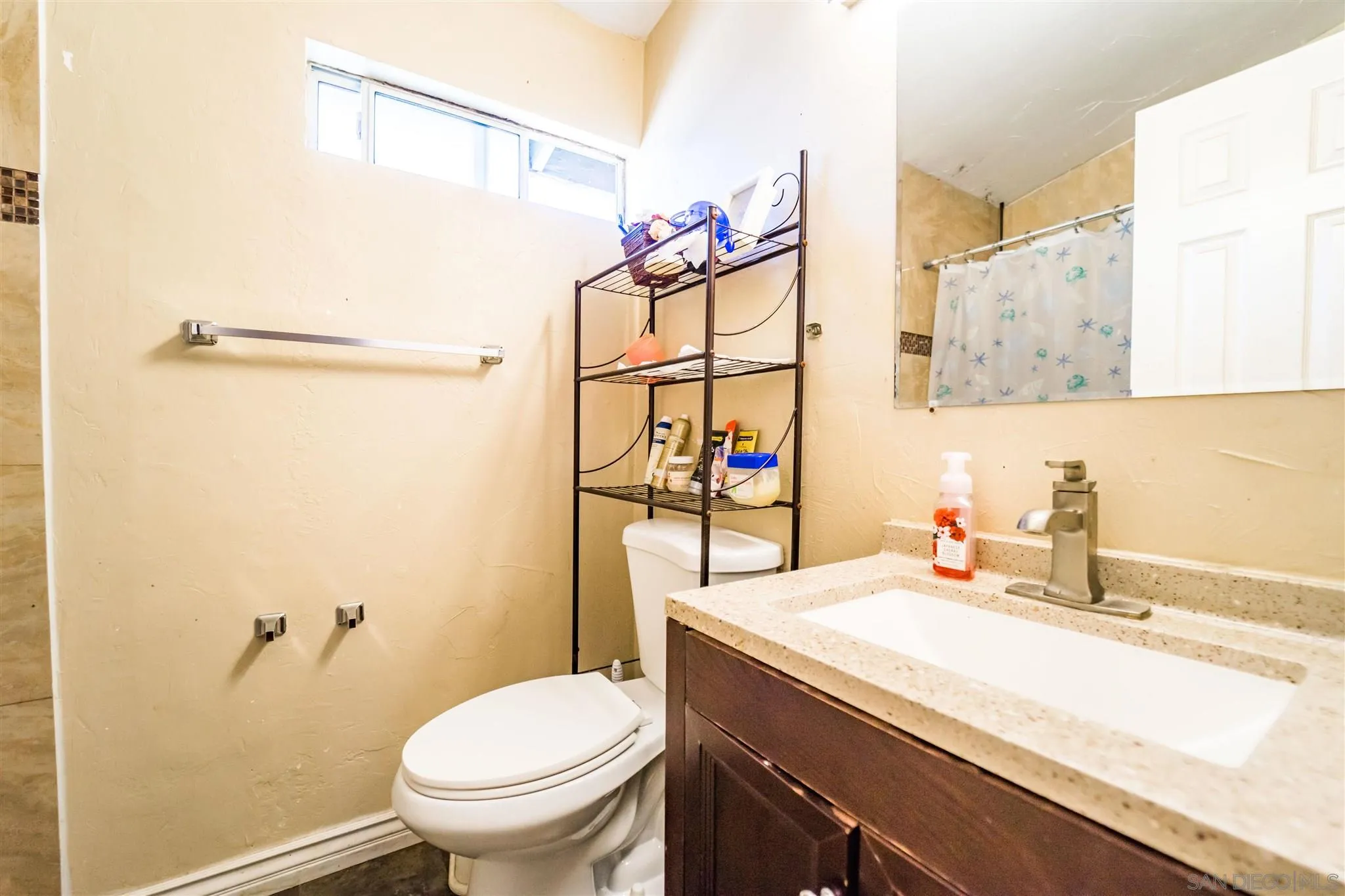 14149 Frame Road Poway, CA 92064 - Photo 12 of 28 a bathroom with a sink a toilet and a mirror