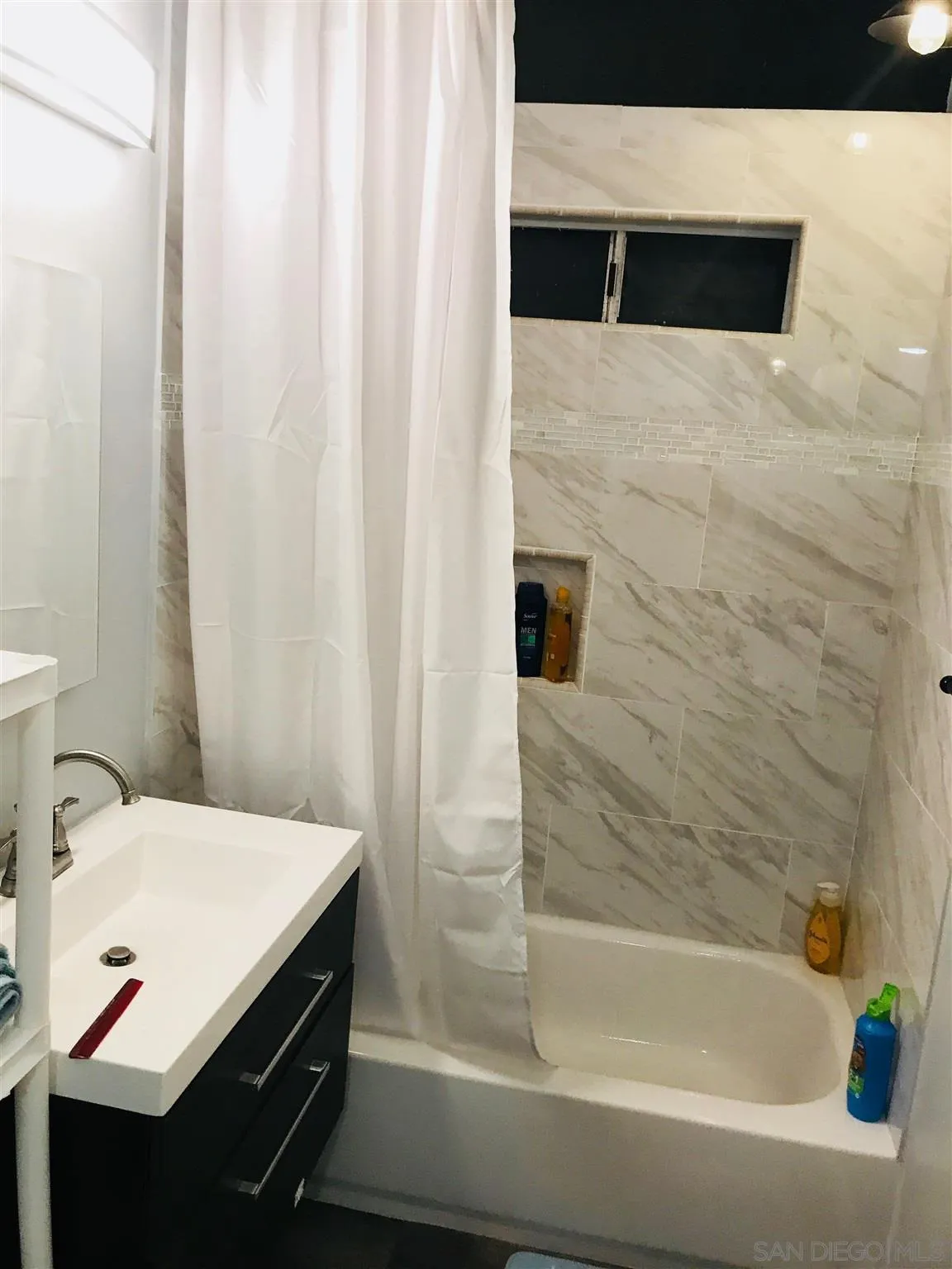 14149 Frame Road Poway, CA 92064 - Photo 17 of 28 a bathroom with a sink and a bathtub