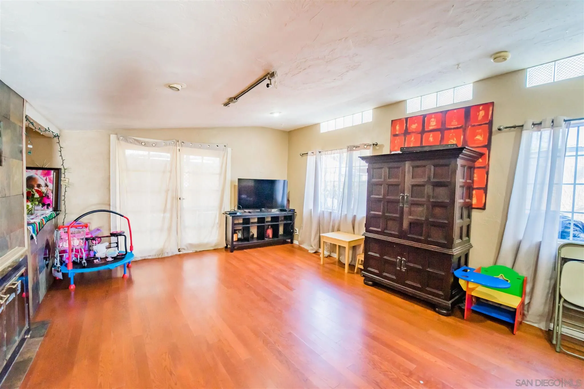 14149 Frame Road Poway, CA 92064 - Photo 6 of 28 a view of game room with window and wooden floor
