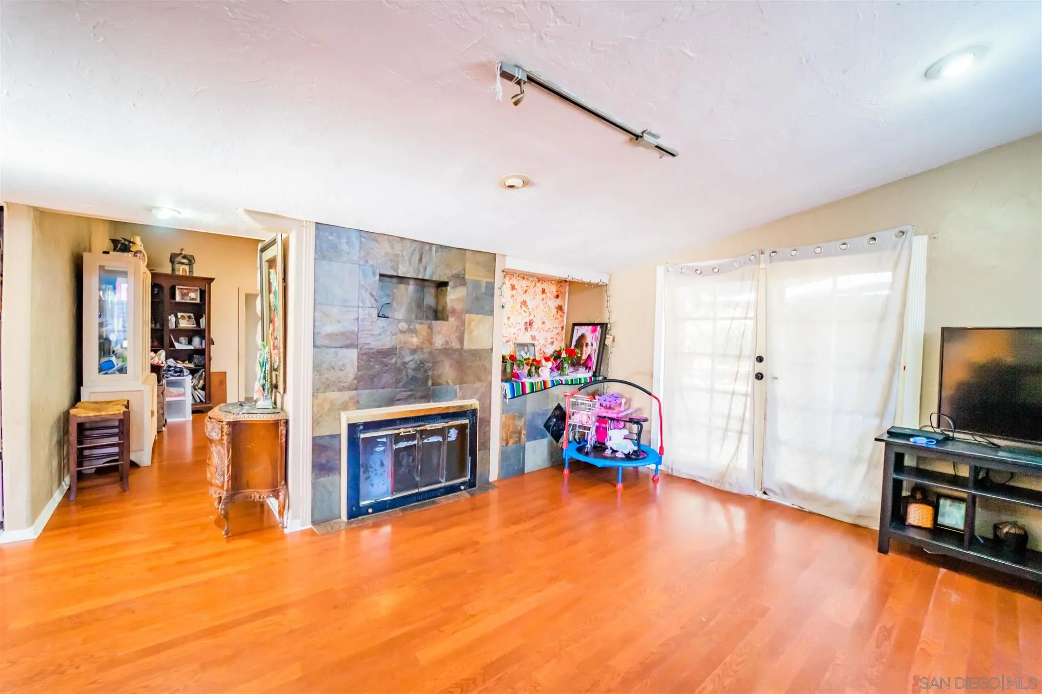 14149 Frame Road Poway, CA 92064 - Photo 7 of 28 a bedroom with furniture and a flat screen tv