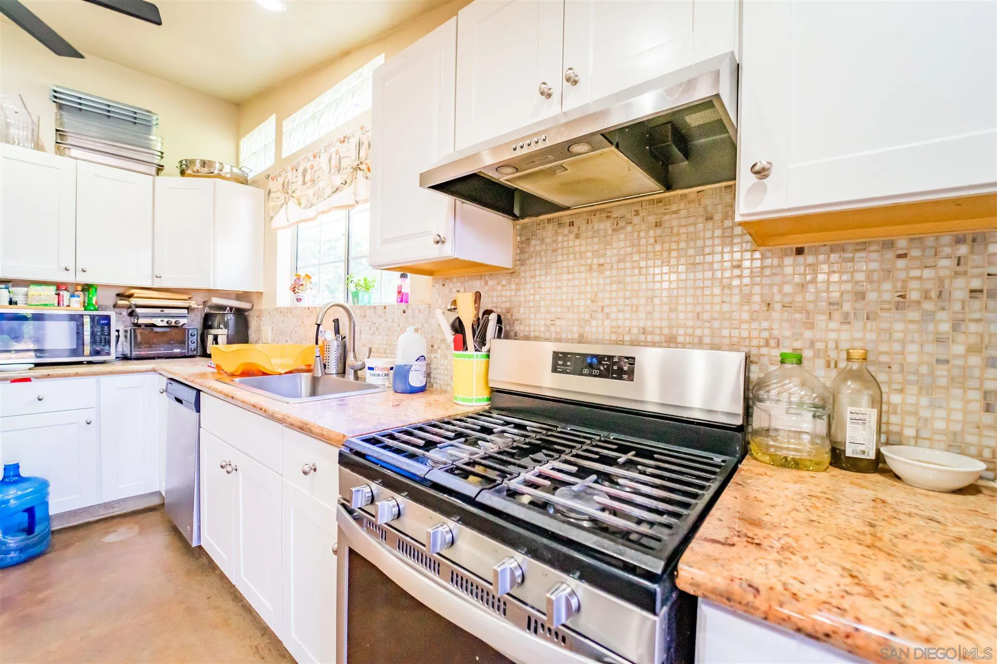 14149 Frame Road Poway, CA 92064 - Photo 9 of 28 a kitchen with a stove and a sink