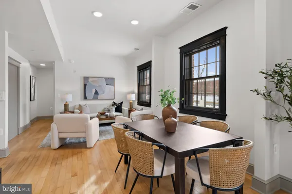 a front view of a house with a garden and yard