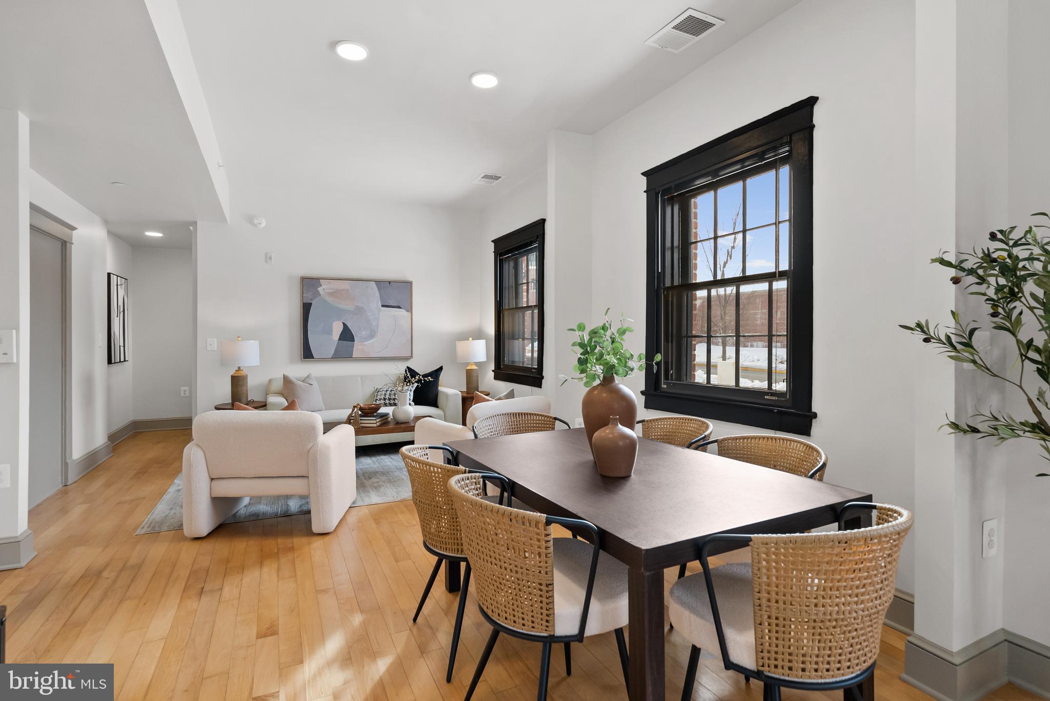 9071 Power House Road, Unit 101 Lorton, VA 22079 - Photo 11 of 47 Beyond the dining area is the living room.