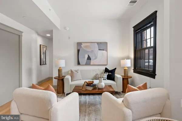 a living room with furniture and a window