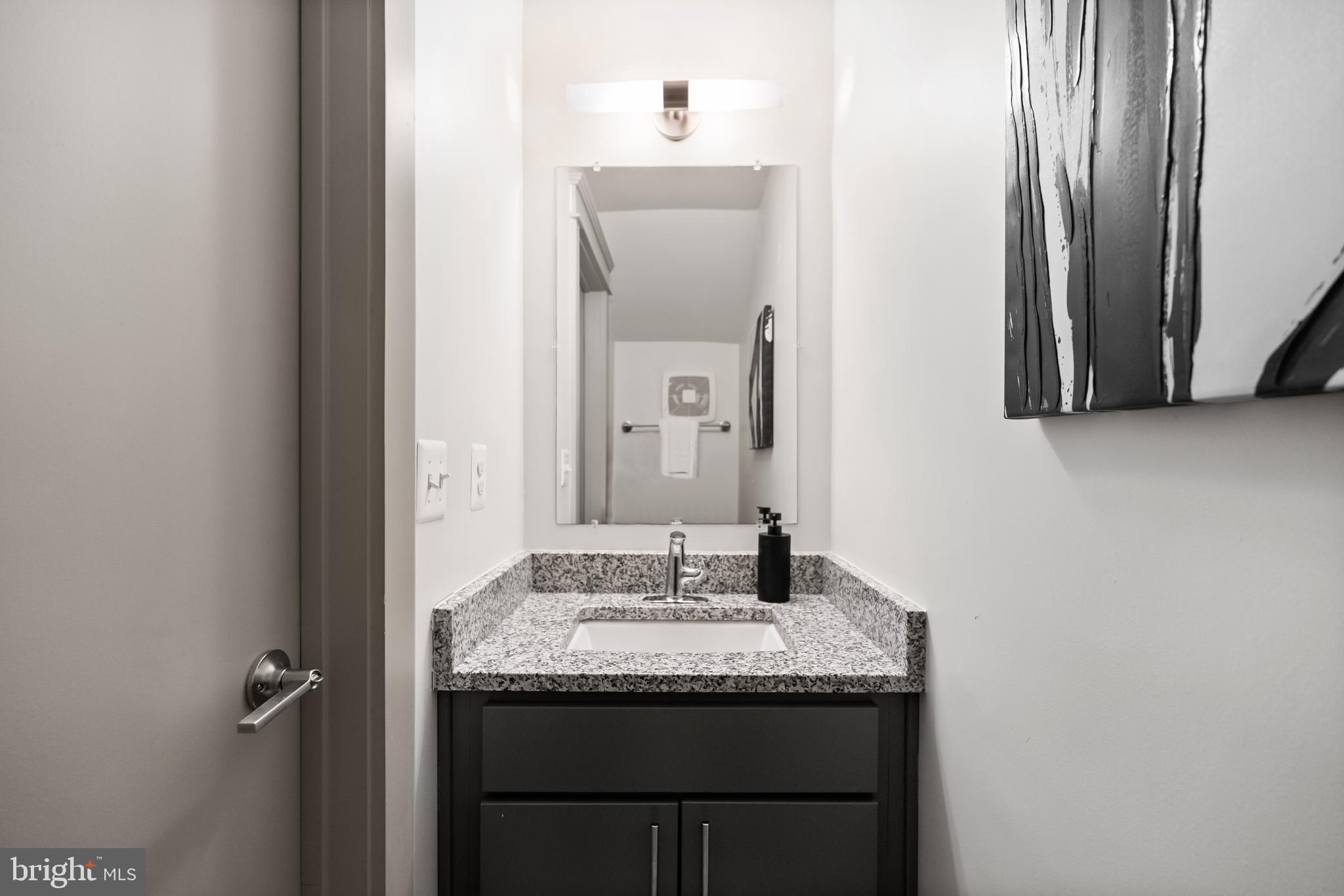 9071 Power House Road, Unit 101 Lorton, VA 22079 - Photo 15 of 47 The main level powder room.