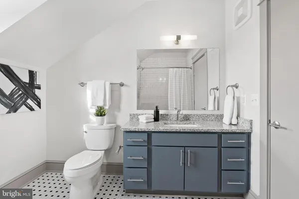 a view of a bathroom from a hallway