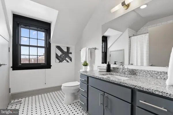 a bathroom with a shower curtain