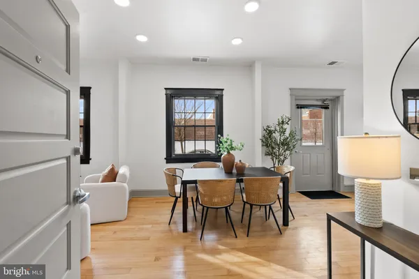 a view of a livingroom with furniture and a window