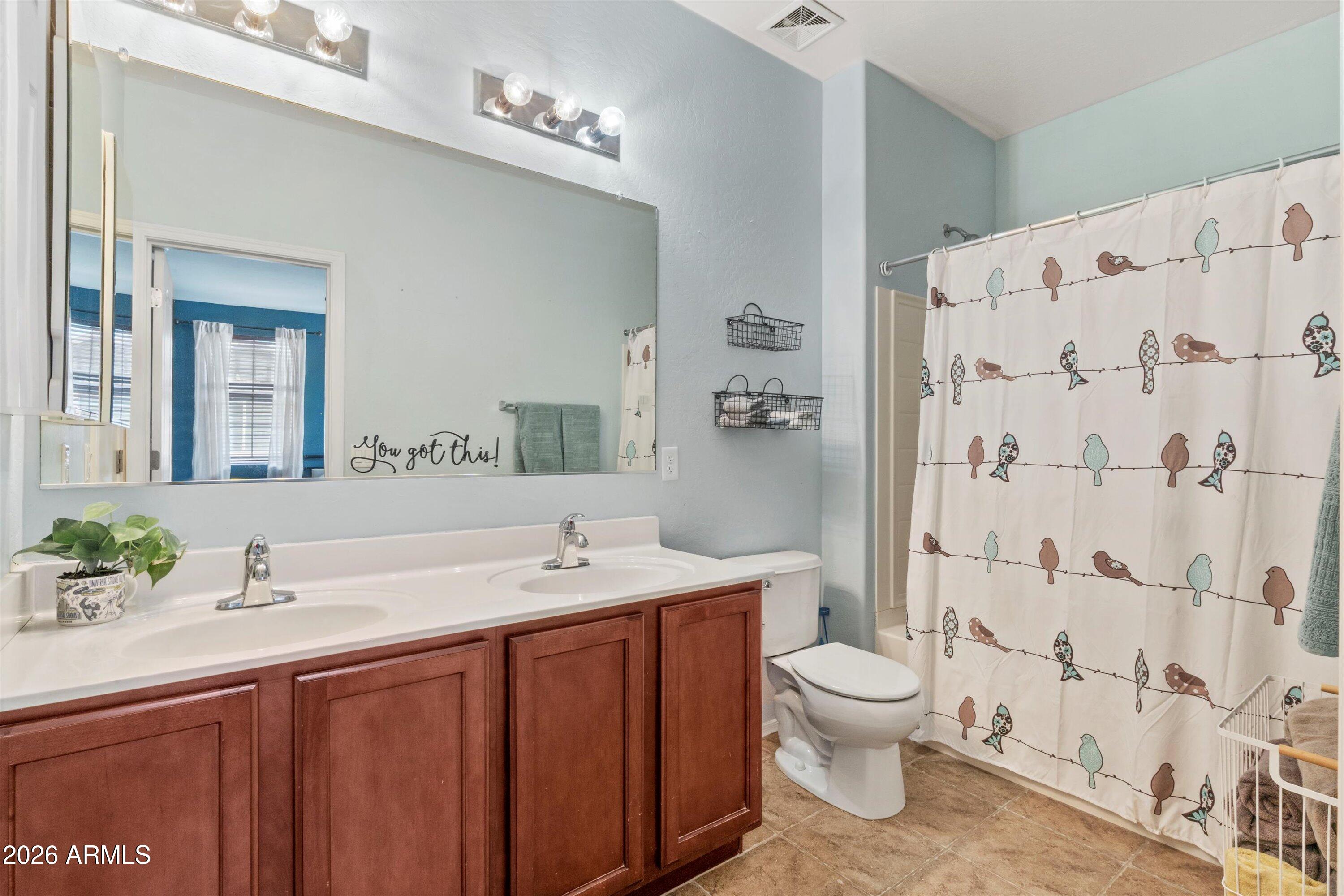 1250 South Rialto, Unit 11 Mesa, AZ 85209 - Photo 17 of 21 a spacious bathroom with a double vanity sink toilet and shower