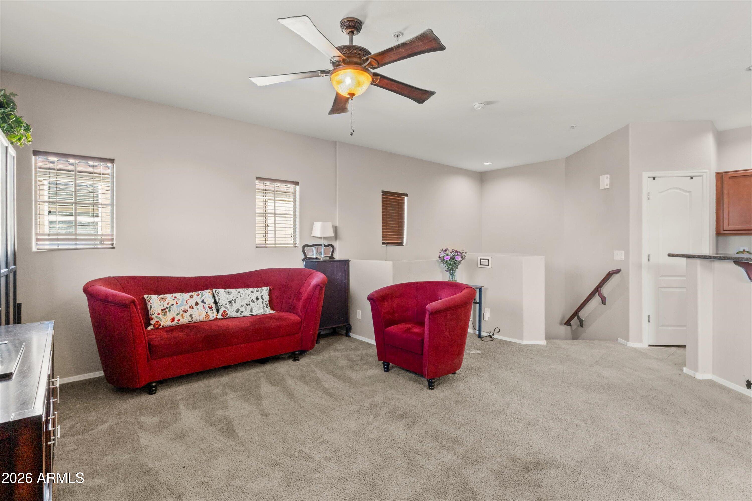 1250 South Rialto, Unit 11 Mesa, AZ 85209 - Photo 10 of 21 a bedroom with furniture and a chandelier